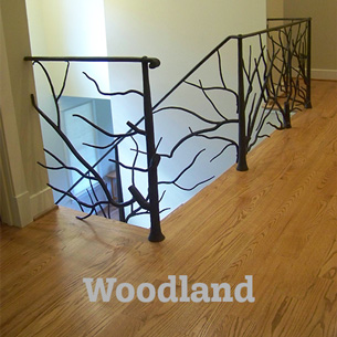 Artist-blacksmith stair railing with forged tree branches