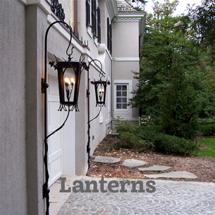 Unusual landscape lanterns light the driveway