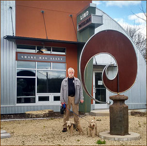 Artist Blacksmith Lee Badger's sculpture, Comma, in front of the Lind Pavillion in Mineral Point, WI